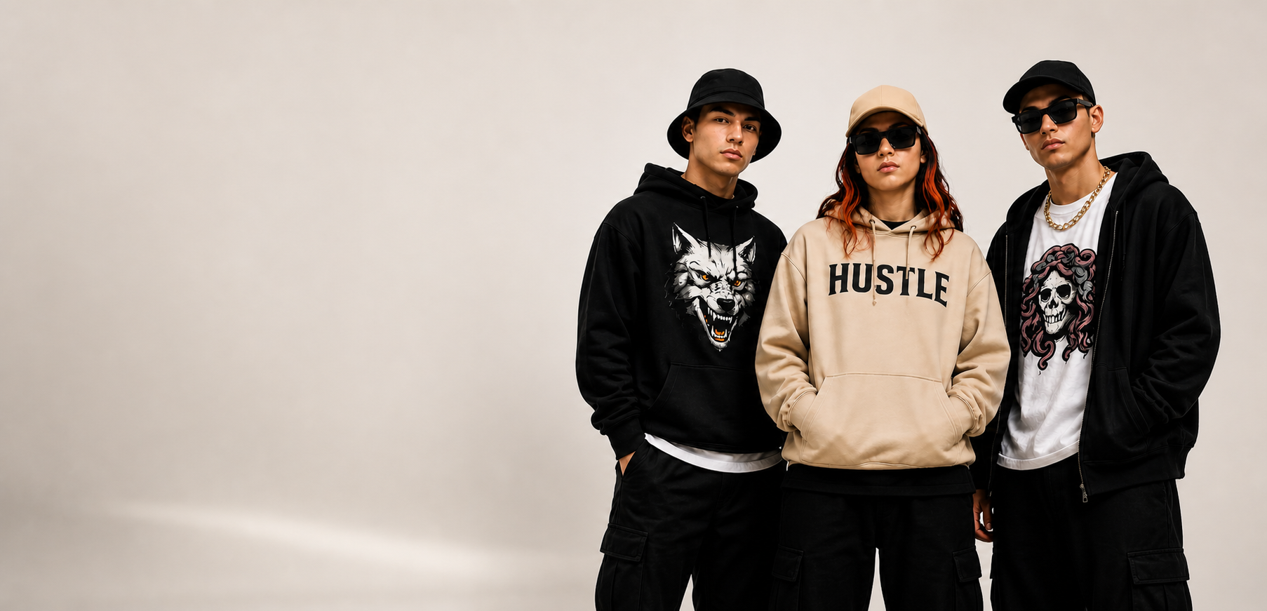 Three people wearing hoodies with graphic designs on a plain background